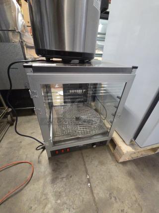 Brand new Carnival King 382HPWR18D2 18" pizza display warmer, tested and working, 120V, 1 phase, visible controls, minor dents.