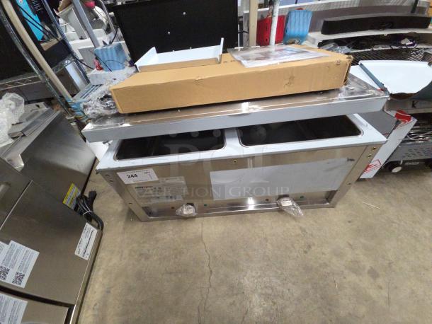 BRAND NEW 2025 ServIt 423EST2WSPB Two Pan Sealed Well Electric Steam Table, partially enclosed base, 120V, tested, visible scratches.