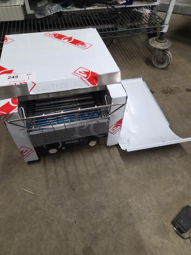 Brand new Galaxy 177GCT10 conveyor toaster with 3" opening, 120V, tested and working, minor scratches, protective covering.