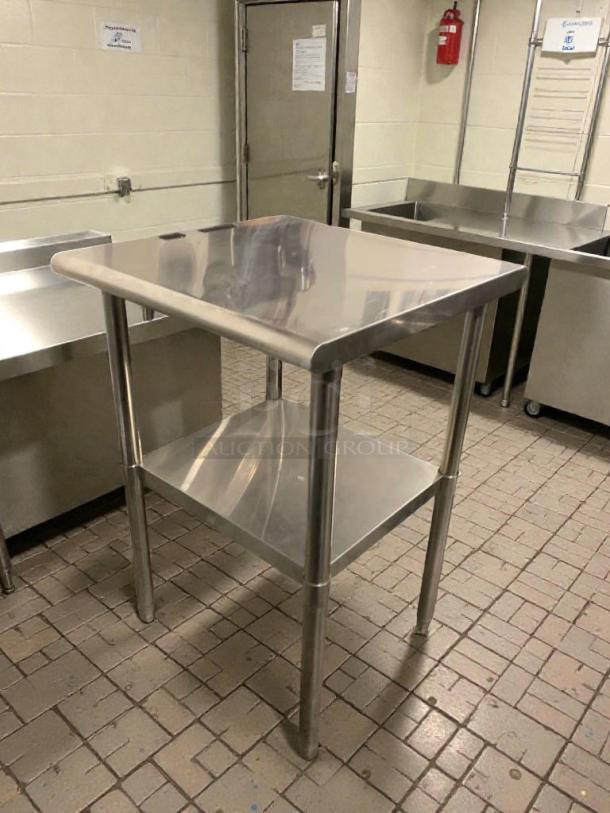Stainless steel commercial prep table, superb condition, heavy-duty, inspected, features a lower shelf, durable construction.