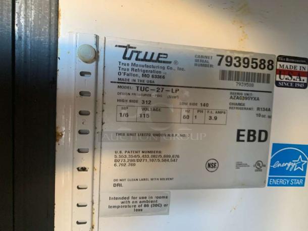 True TUC-27-LP undercounter refrigerator, immaculate condition, 115V, single phase, Energy Star rated, model labeling visible.