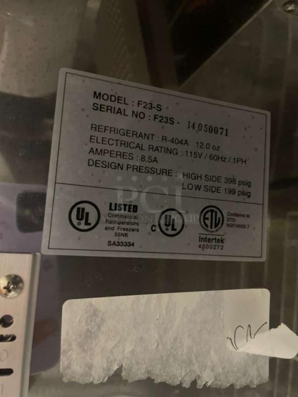 Label on Nor-Lake F23-S freezer showing model, serial number, refrigerant details, electrical rating, and certifications.