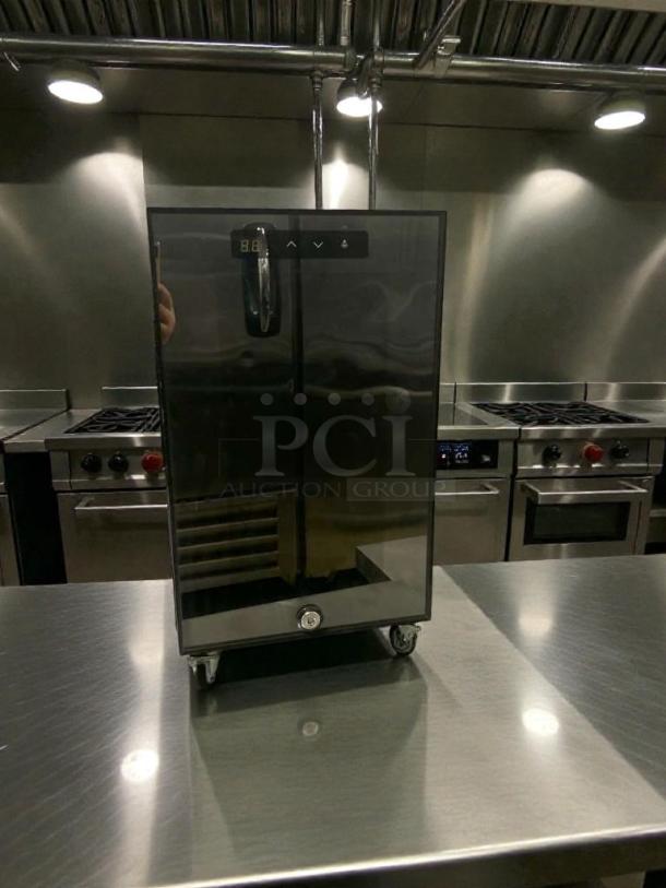 Premium condition MC-18 commercial countertop food warmer with 21L capacity and digital control, 220V, on stainless steel table.