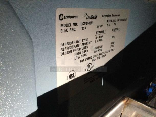 Delfield UCD4448N commercial refrigerated drawer unit label showing model, voltage, and refrigerant details in exceptional condition.