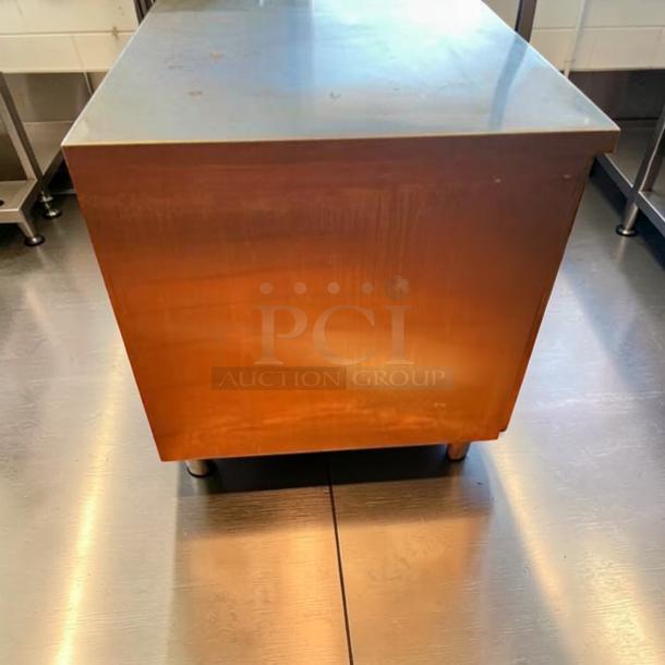 GSW stainless steel storage cabinet, 48"x30"x35", in exceptional condition. Heavy-duty worktop unit for commercial use.