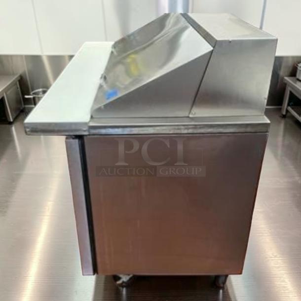 True TSSU-60-24M-B-ST-HC Mega Top Sandwich Prep Table, stainless steel, 60", 2 doors, 24-pan capacity, excellent condition.