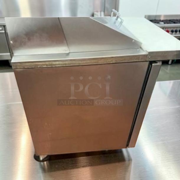 True TSSU-60-24M-B-ST-HC Mega Top Sandwich Prep Table, 60", stainless steel, 2-door, 24-pan capacity, excellent condition.
