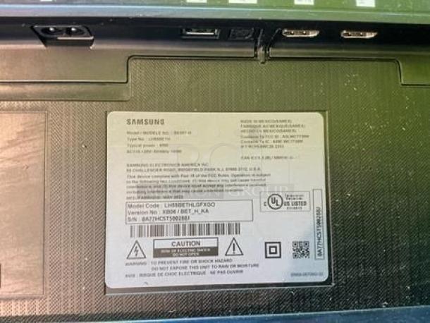 Samsung Q6F Series label on back, model UN55Q7FAMFXZA, showing ports and specifications for 55” QLED 4K UHD Smart TV.