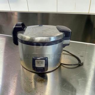 Large capacity stainless steel commercial rice cooker, heavy-duty, tested, operational, with power cord on metal countertop.