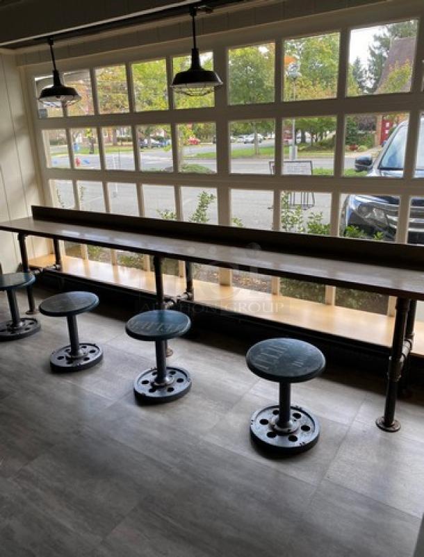 Custom 12' bar seating counter with industrial-style metal legs and stools, like new condition.