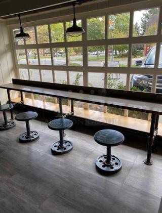 Custom 12' bar seating counter with industrial-style metal legs and stools, like new condition.