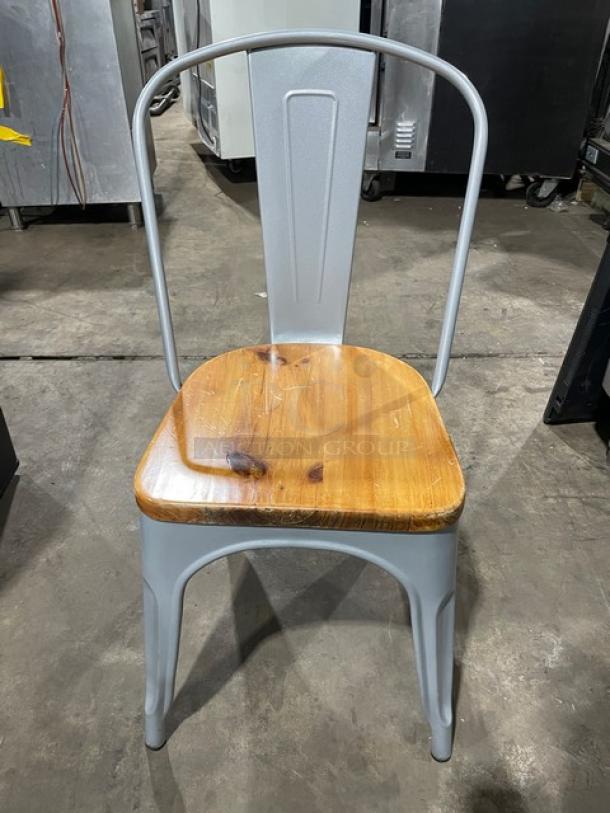 Astor Series dining chair, silver welded frame, wood seat, like new condition, suitable for indoor/outdoor use.