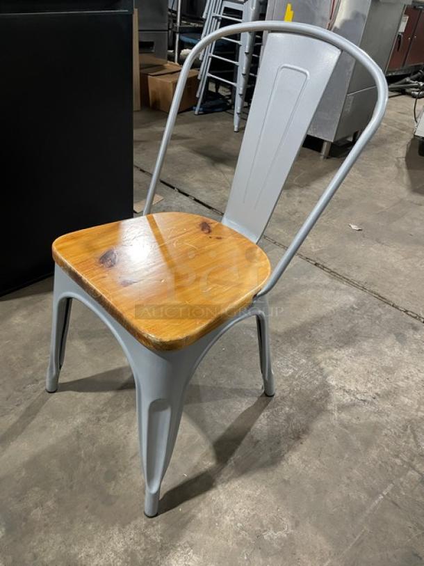 Astor Series silver dining chair with wooden seat, like new condition, suitable for indoor and outdoor use.