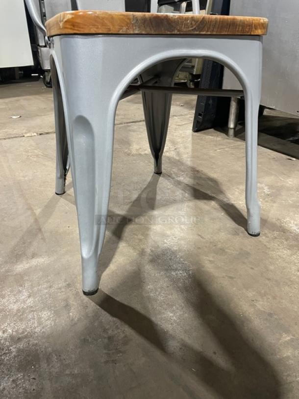 LIKE NEW silver Astor Series welded dining chair with wood seat, suitable for indoor/outdoor use. Auction of 4 per bid.