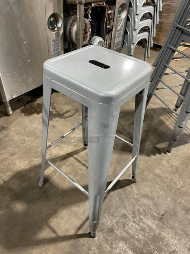 Astor Welded Bar Height Silver Dining Chair, like new condition, metal construction, square seat with handle cutout.