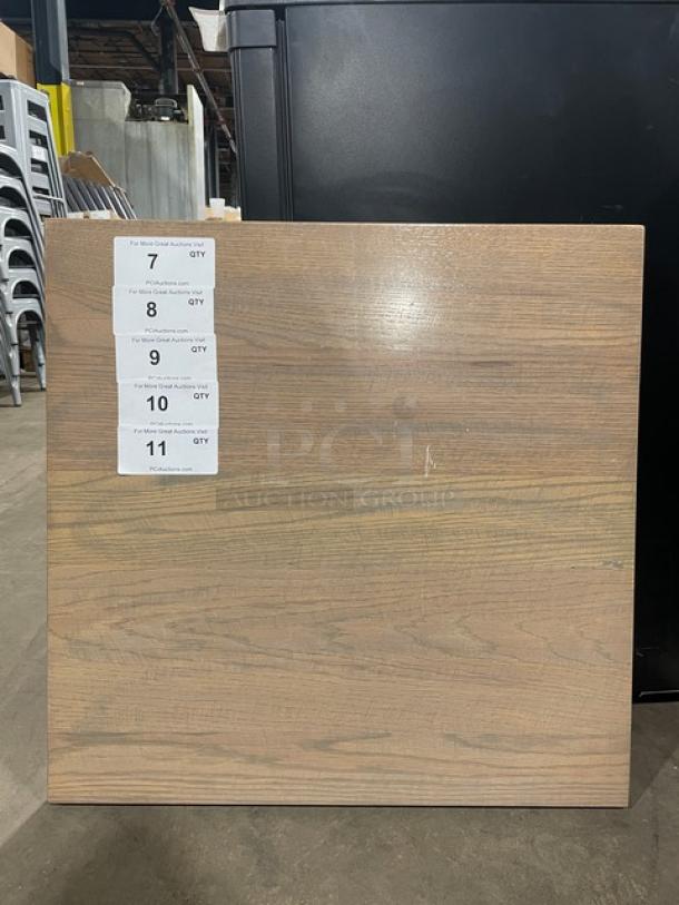 Golden Ash full wood table top, like new condition. Labels indicate quantities available. Smooth surface with natural wood grain.