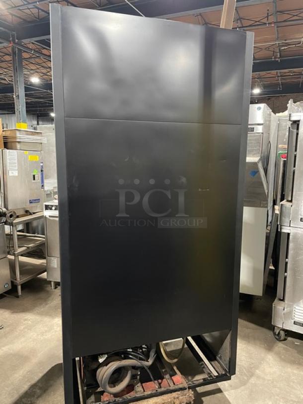 True 2 Door Reach In Cooler Merchandiser, Model GDM35LD, serial 8466398, shown from the back, in used condition.