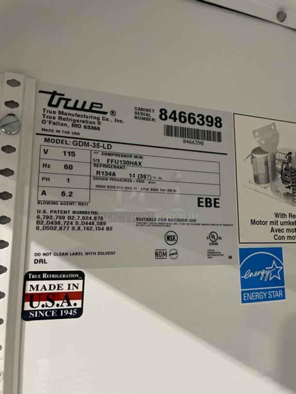 True GDM35LD 2 Door Reach-In Cooler Merchandiser, serial 8466398, energy-efficient, made in USA, late model, NSF certified.