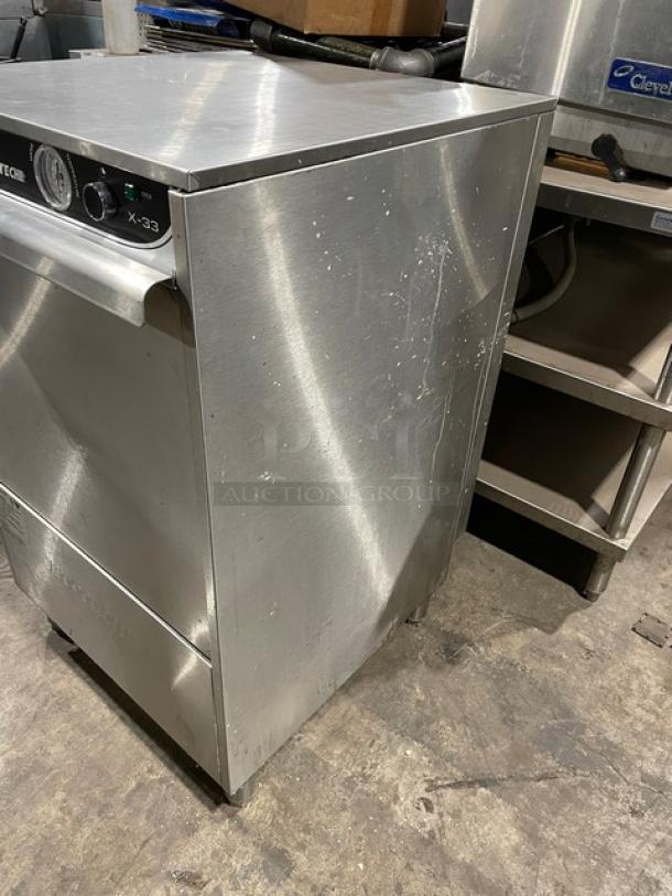 Jet Tech X-33 stainless steel under-counter dishwasher with rack. Model X-33, Serial 152048874, 115V 1Phase, on legs.