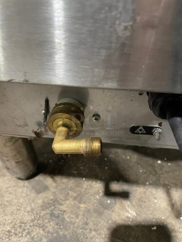 Jet Tech X-33 stainless steel under-counter dishwasher with brass fitting, model plate visible, on legs, 115V, 1 phase.