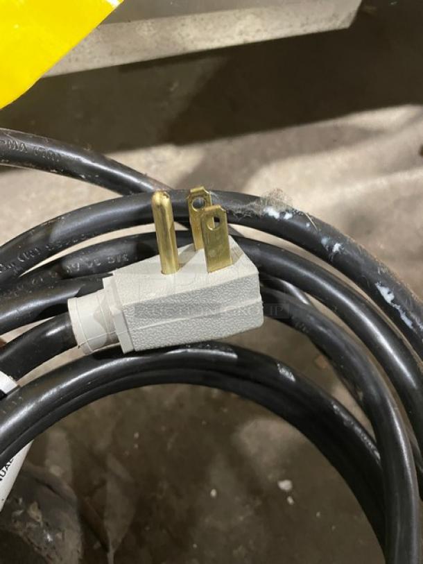 Power cord with a three-prong plug for the True One Door Stainless Steel Lowboy/Worktop Cooler, Model TUC27HC.