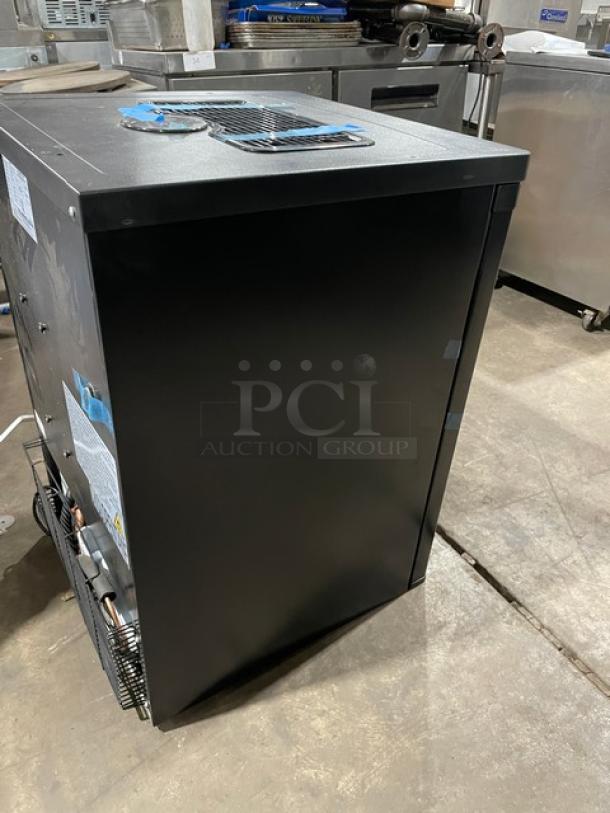 Edgestar BR3002BL one-door beer kegerator, new condition, on casters, with keg, model and serial labels visible.