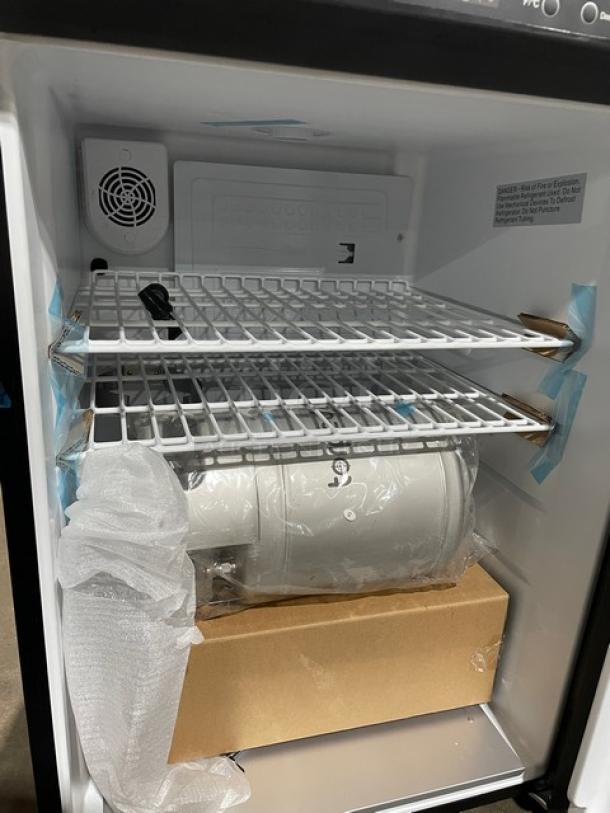 Edgestar BR3002BL one-door beer kegerator with keg, new condition, model BR3002BL, serial A21013130646, on casters.