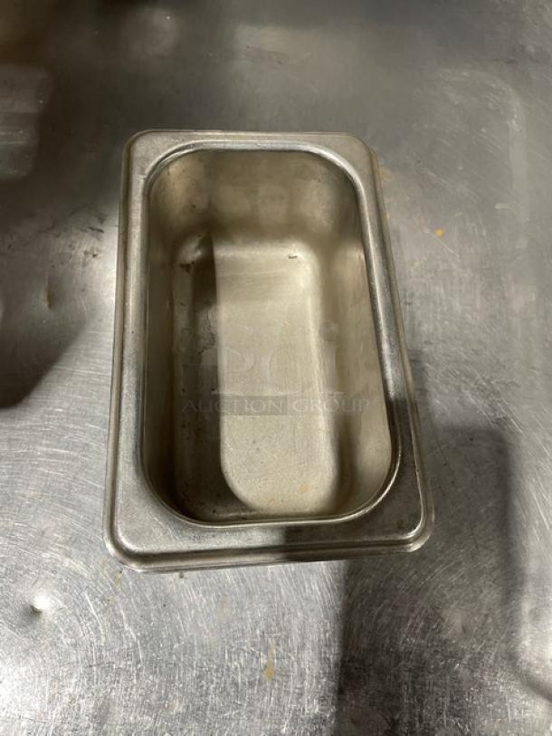 Commercial stainless steel steam table pan, rectangular, used condition, durable, ideal for food service applications.