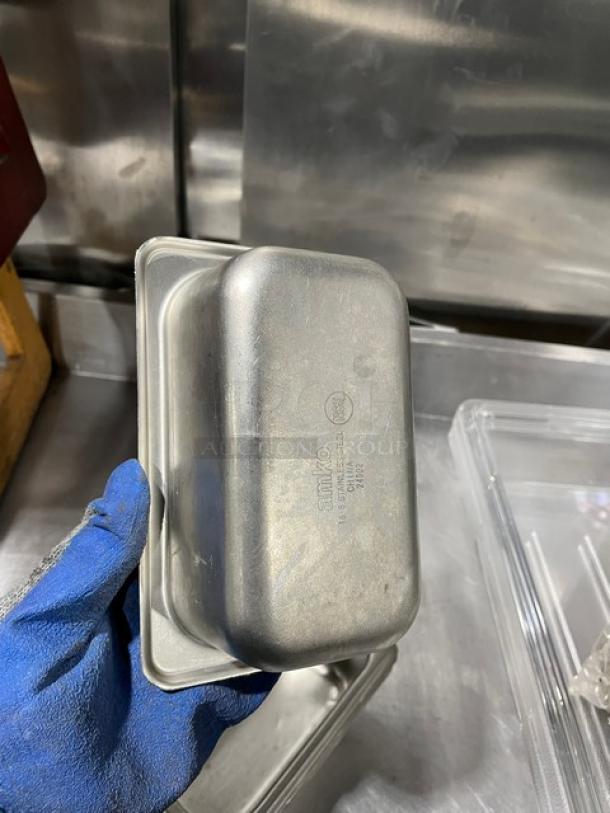Commercial stainless steel steam table pan, durable, lightly used. Marking: "Saniko, USA, 9.44L."
