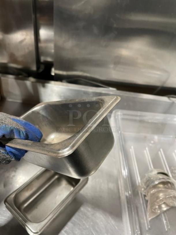 Commercial stainless steel steam table pan, durable, in good condition, rectangular shape. Ideal for catering or kitchen use.