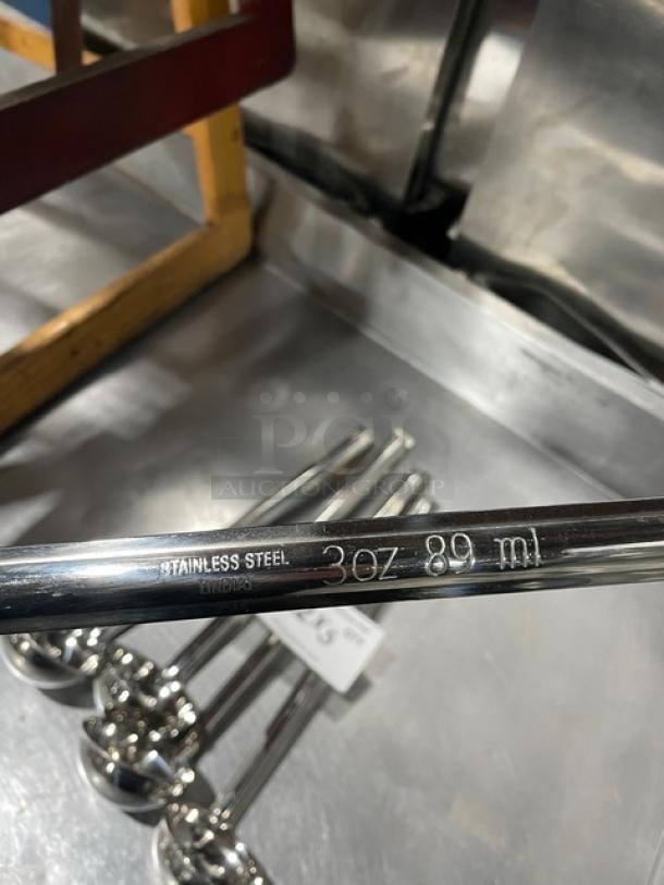 Winco LDI-3 stainless steel 3oz ladle, engraved with "3oz 89ml" and "Stainless Steel India," shown in mint condition.