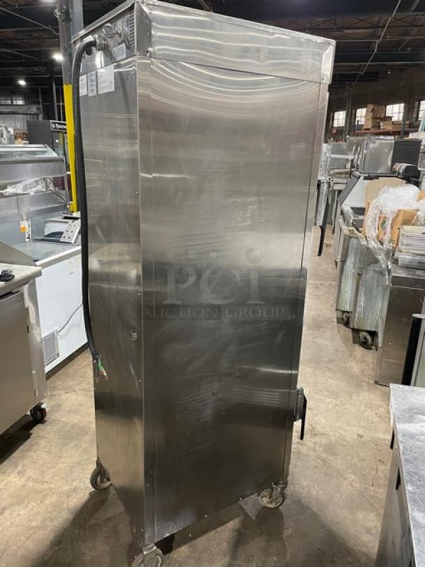 Alto-Shaam stainless steel full height cook & hold oven, model 1200-TH/III, with digital controls and wired oven rack, on casters.