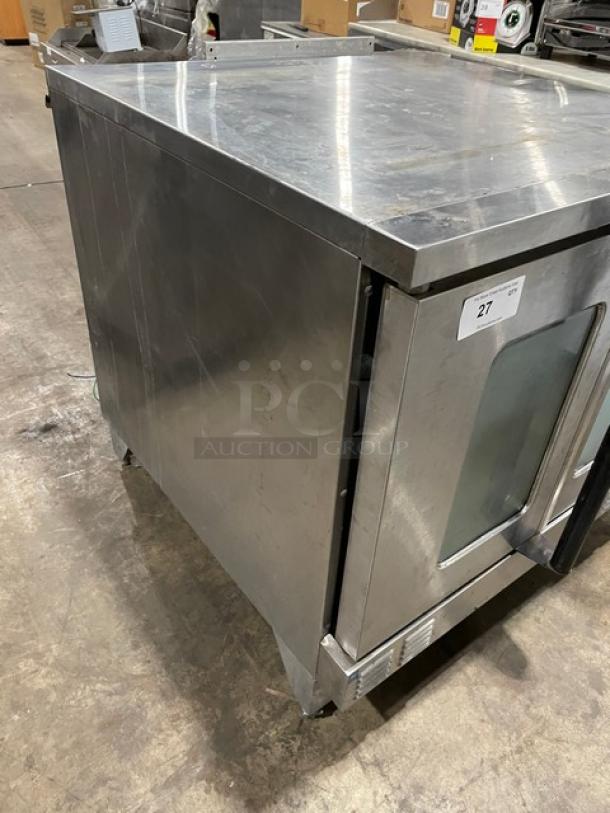 Garland Master Series stainless steel gas convection oven, single stack, on legs. Visible wear, numbered tag 27.