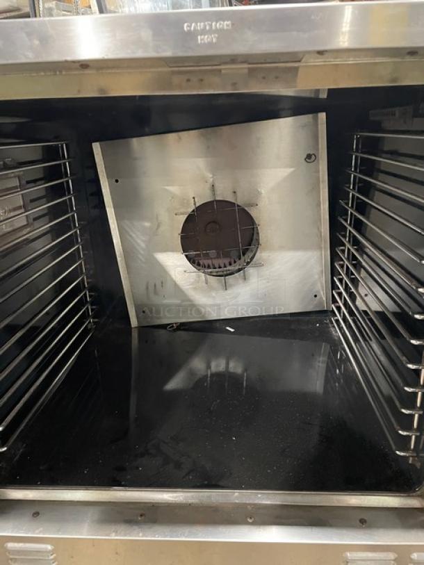 Garland Master Series stainless steel gas convection oven, single stack, on legs, clean interior, visible fan, commercial-grade.