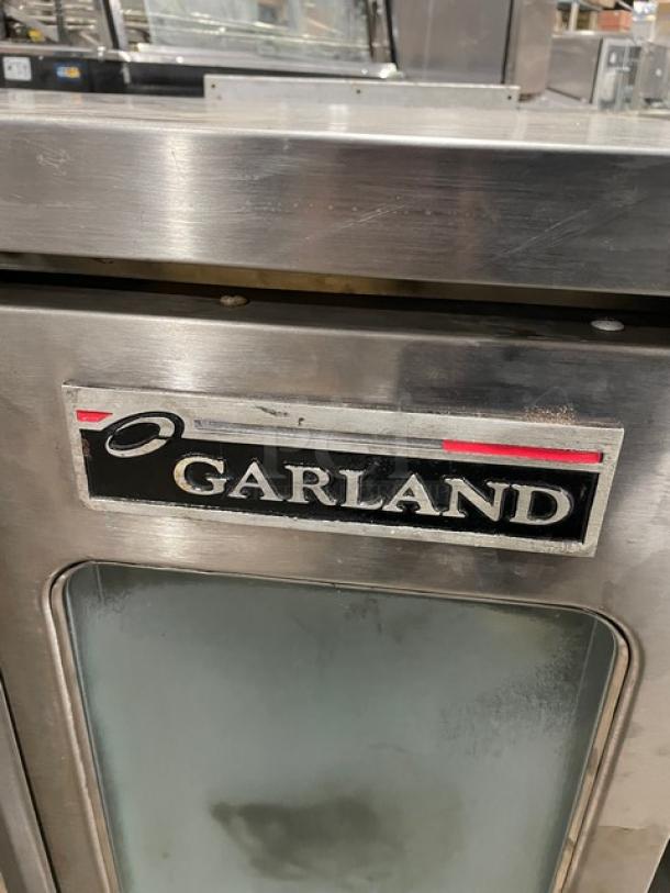 Garland Master Series stainless steel gas convection oven, single stack, on legs, features brand logo on the front.