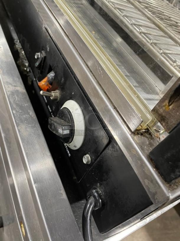 Adcraft 48" commercial heated display showcase with chrome rack, rear sliding doors, and control panel. 120V, multi-tier glass.