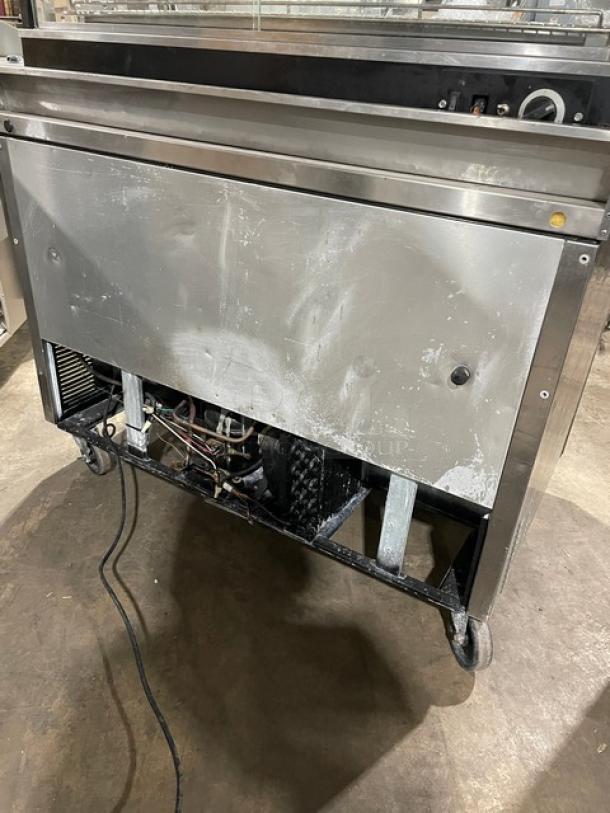 True TWT0-48 stainless steel 2-door undercounter refrigerator, 115V, 1 phase, model on casters, visible wear.