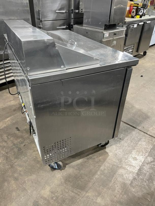 True TSSU-48-08 stainless steel 2-door undercounter refrigerator on casters; commercial use, model 4940880, 115V, sturdy condition.