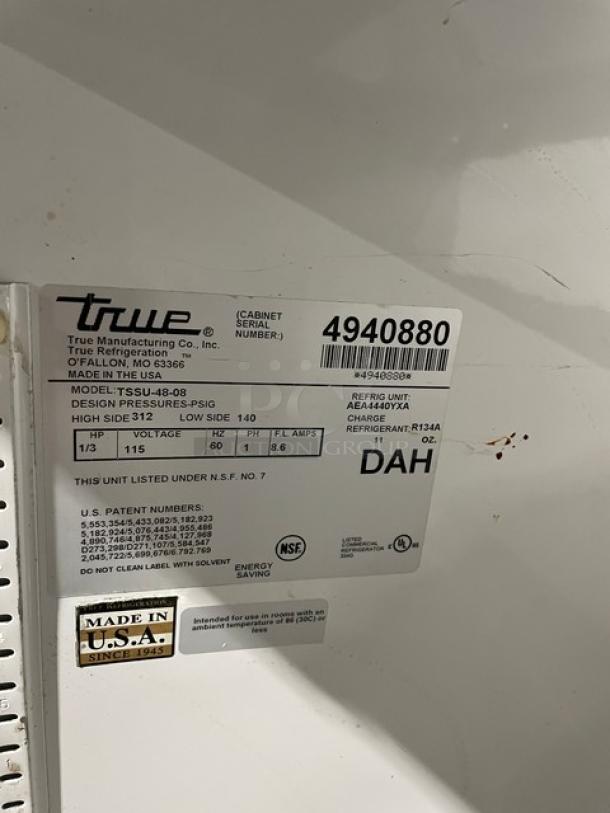 True TSSU-48-08 stainless steel undercounter refrigerator, model 4940880, 115V, 1 phase, on casters, with visible label details.