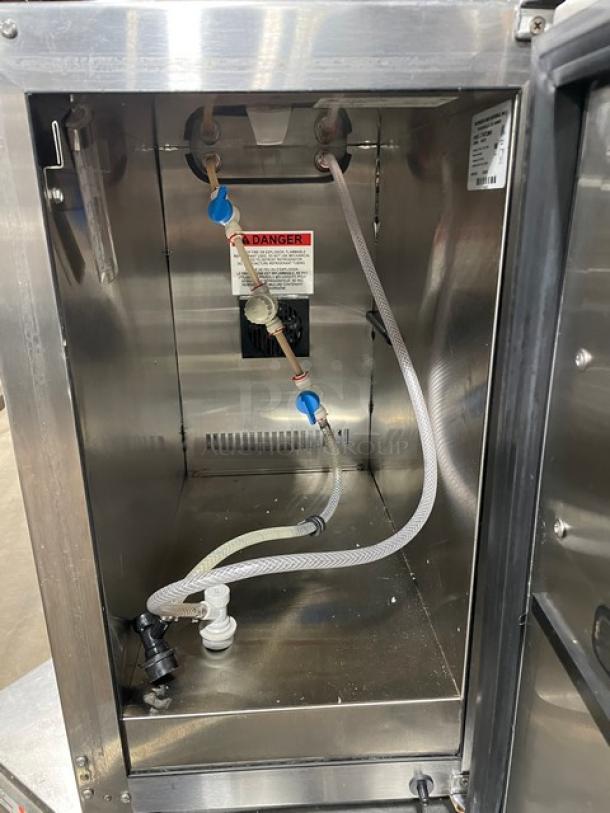 JoeTap JT-NITCOM-R stainless steel nitro cold brew dispenser interior, dual taps, wiring, and warning label visible.