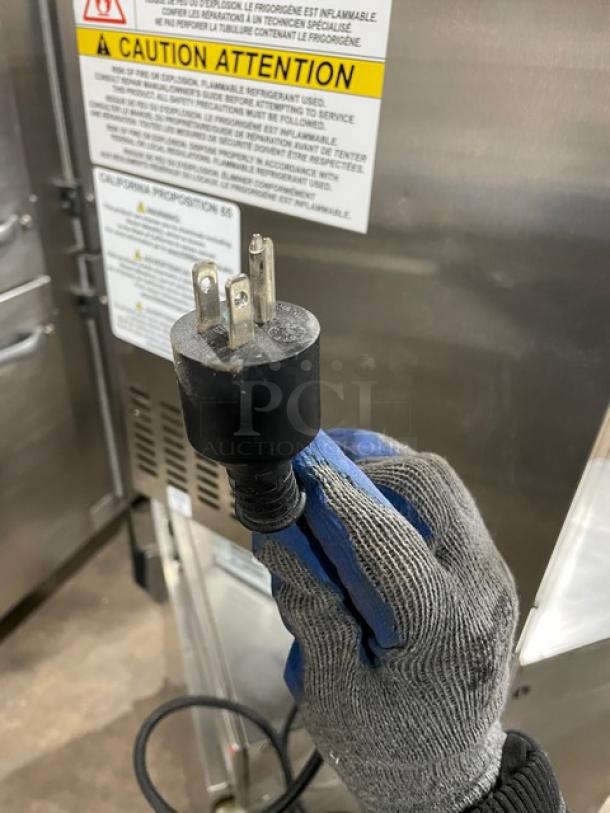 JoeTap stainless steel nitro cold brew dispenser, model JT-NITCOM-R. Dual tap, 115V plug, warning labels visible.