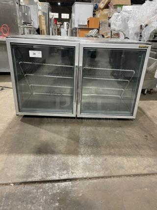 Silver King SK48G commercial stainless steel 2-door glass undercounter freezer with poly-coated wire rack in working condition.