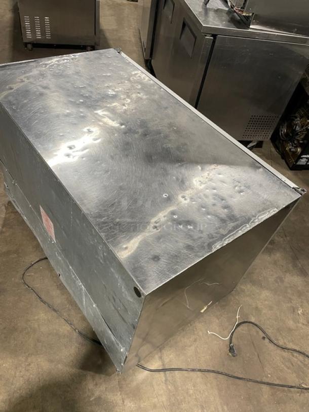 Silver King SK48G stainless steel 2-door glass undercounter freezer, features poly coated wired rack, 115V, top view, fair condition.