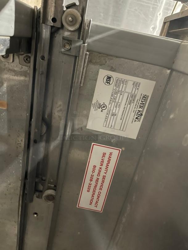 True stainless steel refrigerated prep table, model TSUU4808. Visible NSF certification and warranty label. Electric, 115V.