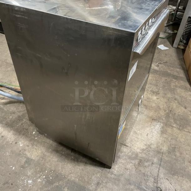 CMA stainless steel electric undercounter dishwasher, Energy Star certified, commercial-grade, minor wear visible.