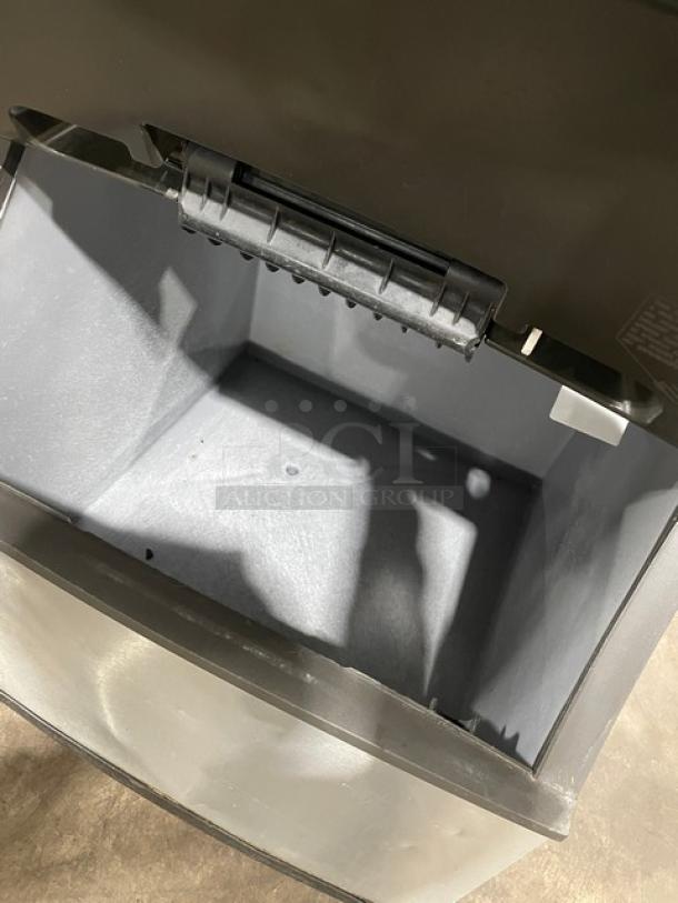 Manitowoc stainless steel ice machine with bin combo, lift-open access, on legs, excellent condition.