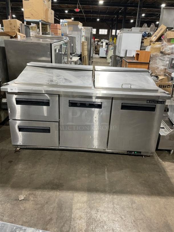 Sun Ice stainless steel refrigerated prep table, model LUNST72-30, with 2 drawers and doors, on casters; serial 7023838.
