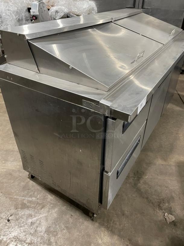 Sun Ice stainless steel refrigerated prep table, model LUNST72-30, features 2 drawers, 2 doors, on casters, 115V, good condition.