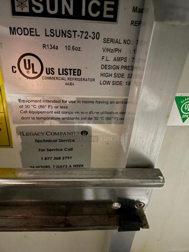 Sun Ice refrigerated prep table, model LUNST72-30, serial 7023838. Features 2 drawers, 2 doors, and casters. 115V, 1 phase.