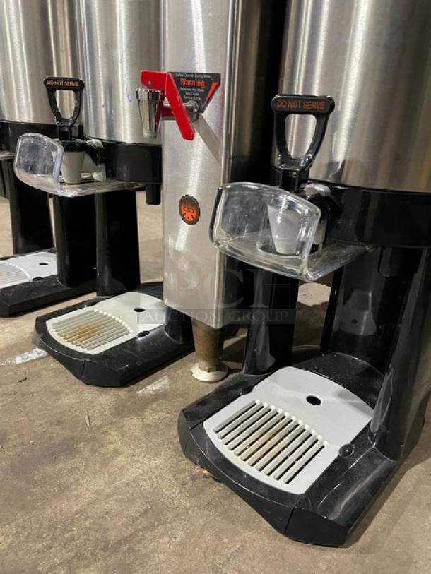 Fecto CBS-2142-XTS automatic coffee brewer with three satellite air pots, stainless steel, on legs, 208-230V, good condition.